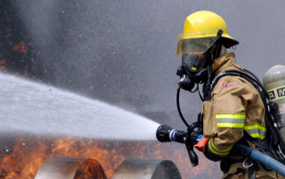 US_Navy_080730-N-5277R-003_A_Commander,_Naval_Forces_Japan_firefighter_douses_a_fire_on_a_dummy_aircraft_during_the_annual_off-station_mishap_drill_at_Naval_Support_Facility_Kamiseya